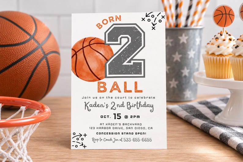 May include: A rectangular birthday invitation card featuring a basketball theme with the text BORN 2 BALL, Kaden's 2nd Birthday, Oct. 15 at 2pm, Kaden's Backyard, 123 Harbor Drive, San Diego, CA, Concession Stand Open, and RSVP to Coach Jen at 533-655-6655.