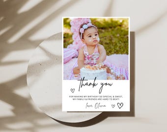 May include: A thank you card with a photo of a young girl in a pink dress and a flower headband. The card says "Thank you" and "For making my birthday so special & sweet, my family & friends are hard to beat! Love, Olivia."