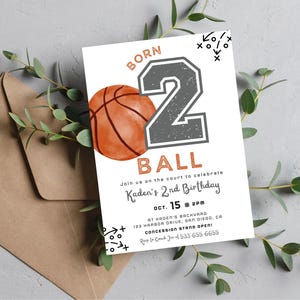 May include: A rectangular birthday invitation card featuring a watercolor basketball, a large grey number 2, and the text BORN 2 BALL. The card includes event details for Kaden's 2nd Birthday on Oct. 15 at 2PM, with black tactical play diagrams.