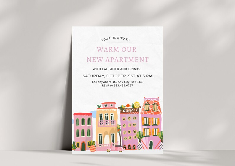 May include: A housewarming party invitation with a colorful illustration of a row of houses and a scooter. The text reads "You're invited to warm our new apartment with laughter and drinks. Saturday, October 21st at 5 PM. 123 anywhere st., Any City, st 12345. RSVP to 533.455.6767."