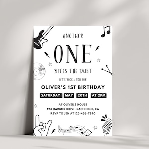 May include: Black and white birthday party invitation with a rock and roll theme. The invitation says "Another One Bites the Dust" and "Let's Rock & Roll for Oliver's 1st Birthday". The invitation includes a guitar, a record, a microphone, and musical notes.