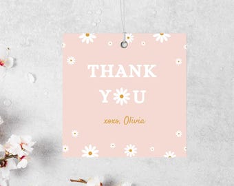 May include: Pink thank you card with white daisies and the text "THANK YOU" in white with a gold star and the text "xoxo, Olivia" in gold.