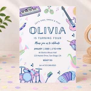 May include: A rectangular birthday invitation card featuring colorful musical instrument illustrations including a keyboard, guitar, drums, and accordion. The text reads: LET'S SING, DANCE & PLAY OLIVIA IS TURNING FOUR. Please join us to celebrate JANUARY | 23RD | 2 TO 4 PM At Olivia's Music Hall 123 Harbor Drive, San Diego, CA RSVP TO Jen at 533.366.6565.
