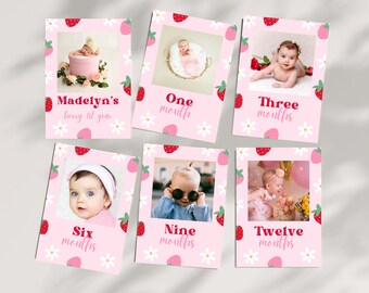 Puede incluir: Seis tarjetas rosas con fotos de una niña bebé a diferentes edades. Cada tarjeta tiene un patrón de fresas y flores y un texto que dice "Madelyn's berry 1st year", "One month", "Three months", "Six months", "Nine months" y "Twelve months".