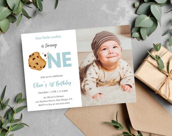May include: A blue and white birthday invitation with a cookie illustration and the text "Our little cookie is turning ONE". The invitation includes details for Oliver's 1st birthday party, including the date, time, location, and RSVP information.