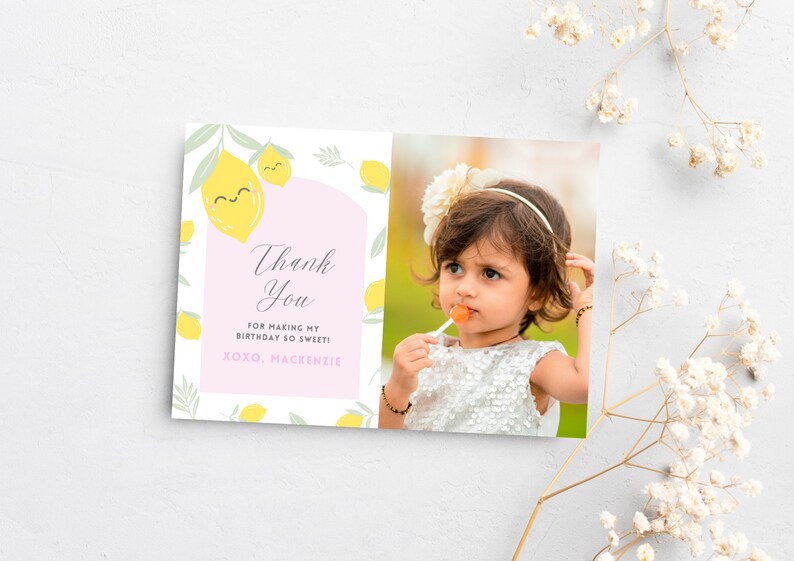 May include: A pink and white thank you card with a lemon theme. The card has a photo of a young girl with a flower headband and a lollipop. The text on the card reads "Thank You for making my birthday so sweet! xoxo, Mackenzie".