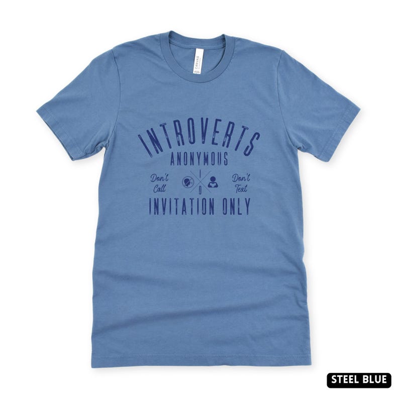 May include: A white ceramic mug with a black handle and the text "But First, Coffee" in a handwritten style. The mug is on a white surface. The mug is 10 cm tall.