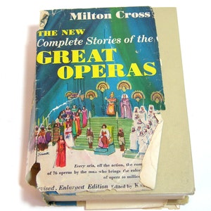 May include: A vintage book titled "The New Complete Stories of the Great Operas" by Milton Cross. The cover features a colorful illustration of a stage scene with figures in costumes. The book is an enlarged edition.