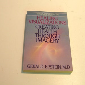May include: A paperback book titled Healing Visualizations: Creating Health Through Imagery by Gerald Epstein, M.D. The cover features a gradient background transitioning from blue to purple with a soft light effect and dark blue text.