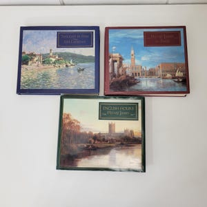 May include: Three hardcover books with colorful covers and titles. The book on the left is blue with the title "Twilight in Italy" by D.H. Lawrence. The book in the middle is green with the title "English Hours" by Henry James. The book on the right is red with the title "Henry James in Italy".