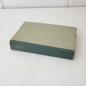 May include: A green hardcover book with gold lettering on the spine that reads "The Story of  Great Peking".