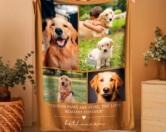 May include: A tan fleece blanket featuring a collage of golden retriever photos. The blanket has the text "THOUGH PAWS ARE GONE, THE LOVE REMAINS FOREVER" and a signature. The photos show dogs of different ages.