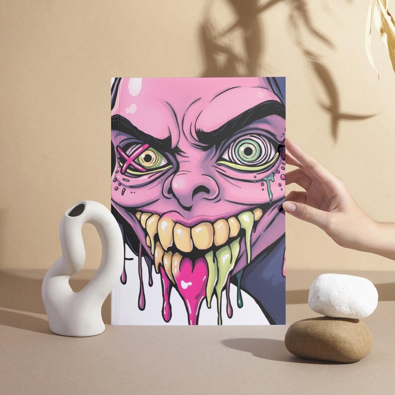 May include: A pink and green cartoon face with a wide open mouth and dripping slime. The face has a cross over one eye and a spiral in the other eye.