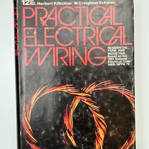 May include: A vintage book titled "Practical Electrical Wiring" with red text on a black cover. The cover features a stylized image of intertwined electrical wires in shades of red and orange. The book is the 12th edition.