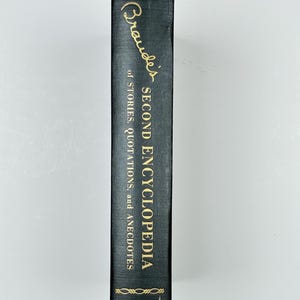 May include: A dark green hardcover book titled "Brawde's Second Encyclopedia of Stories, Quotations, and Anecdotes" with gold lettering. The book is published by Prentice Hall.