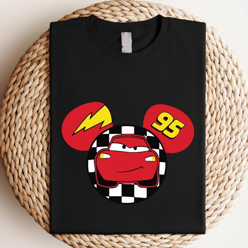 A black t-shirt with a graphic design featuring a red car and a lightning bolt, along with the number 95.