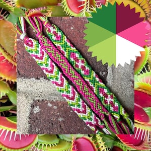 May include: Two handmade woven friendship bracelets featuring a repeating chevron and geometric pattern in vibrant shades of magenta, lime green, forest green, and white, with loose thread ends visible at the top of each bracelet.