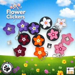 May include: A collection of flower-shaped clickers in various colors, including purple, pink, orange, and white, with black circular bases. Some have keychains. The text "Flower Clickers" is displayed at the top.