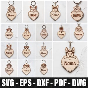 May include: A collection of wooden keychains featuring various dog breeds. Each keychain has a heart-shaped design with the word "Name" engraved on it. The keychains are attached to metal rings.