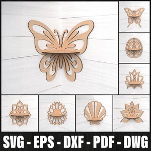May include: Wooden butterfly-shaped shelf mounted on a white wall. The shelf has a small platform for displaying items. Additional images show shelves in various shapes, including a shell, lotus flower, and sunburst. The bottom of the image displays the text: SVG - EPS - DXF - PDF - DWG.