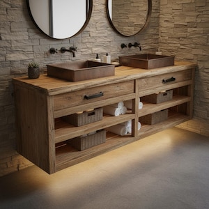 May include: A rustic wooden bathroom vanity with two copper sinks and black hardware. The vanity features drawers, open shelves with woven baskets, and rolled white towels. Two round mirrors and a stone wall complete the design.