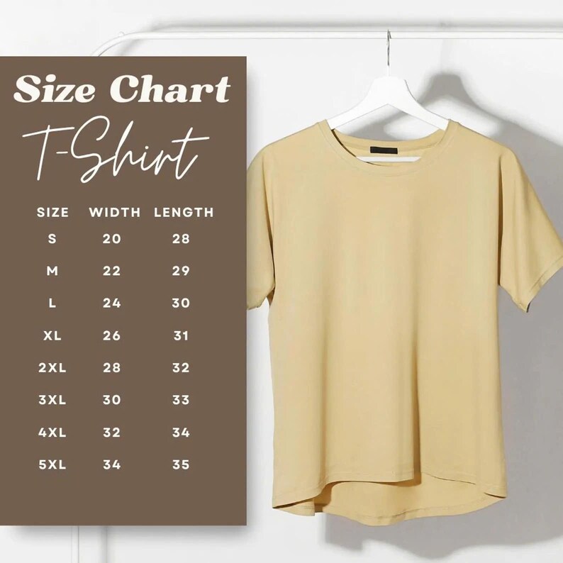 May include: A light tan T-shirt hangs on a white hanger. A size chart is displayed to the left, with measurements in inches for sizes S through 5XL. The chart lists width and length measurements for each size. The shirt has a crew neck and short sleeves.