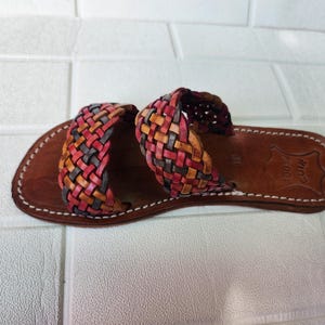 moroccan sandals, handmade sandals, boho sandals women, braided sandals, leather slides women, summer sandals, colorful leather shoes, open toe leather flats, leather shoes for women, slip on summer sandals, beach sandals women, casual leather sandals, flat sandals women, artisan sandals, moroccan shoes, ethnic leather sandals, barefoot sandals, rustic leather shoes, women’s holiday shoes, strappy leather slides, leather footwear, earthy tone sandals, hippie sandals, gypsy sandals