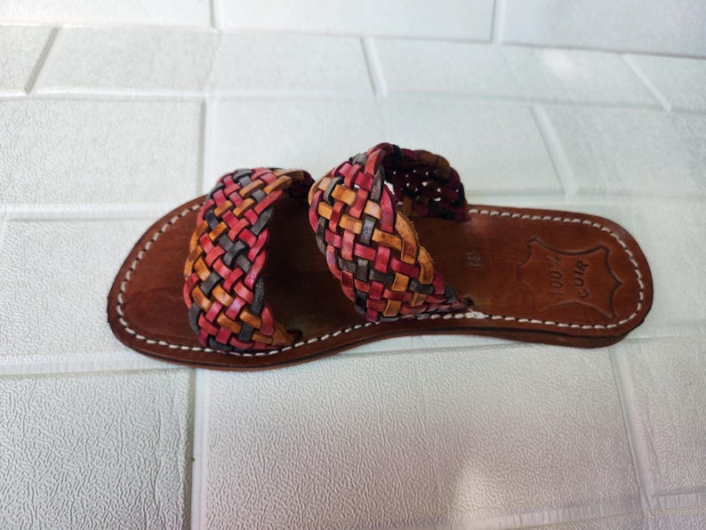 moroccan sandals, handmade sandals, boho sandals women, braided sandals, leather slides women, summer sandals, colorful leather shoes, open toe leather flats, leather shoes for women, slip on summer sandals, beach sandals women, casual leather sandals, flat sandals women, artisan sandals, moroccan shoes, ethnic leather sandals, barefoot sandals, rustic leather shoes, women’s holiday shoes, strappy leather slides, leather footwear, earthy tone sandals, hippie sandals, gypsy sandals