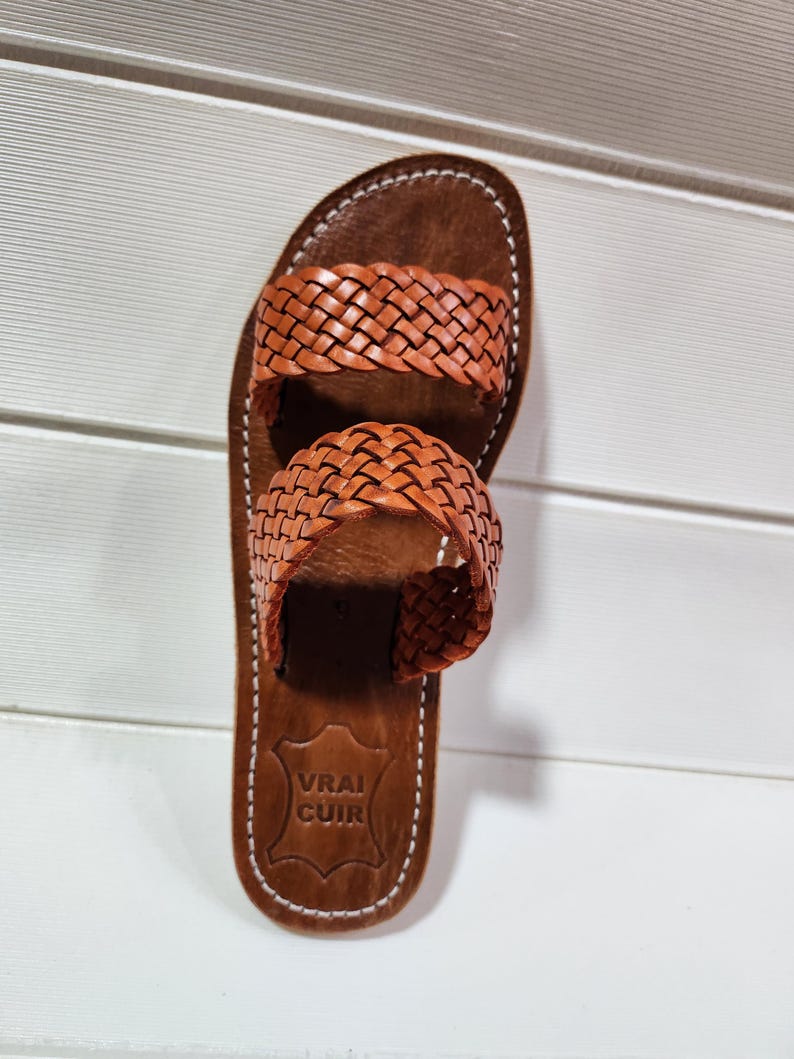 woven leather sandals, moroccan leather sandals, boho sandals women, brown leather sandals, braided leather sandals, artisan flat shoes, moroccan slides, handmade slippers women, summer beach sandals, bohemian leather sandals, real leather sandals, flat moroccan sandals, comfy summer shoes, leather sandals for women, vacation sandals, moroccan fashion shoes, traditional moroccan slippers, stylish flat sandals, rustic leather shoes, braided slide sandals, slip on boho sandals, boho flat leather