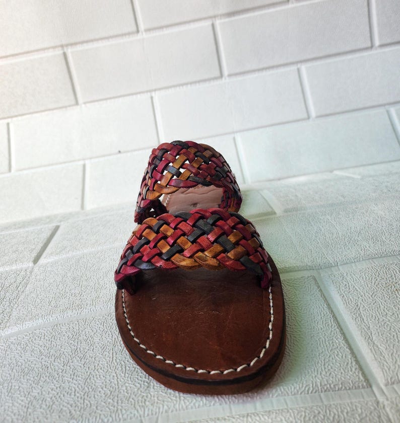 moroccan sandals, handmade sandals, boho sandals women, braided sandals, leather slides women, summer sandals, colorful leather shoes, open toe leather flats, leather shoes for women, slip on summer sandals, beach sandals women, casual leather sandals, flat sandals women, artisan sandals, moroccan shoes, ethnic leather sandals, barefoot sandals, rustic leather shoes, women’s holiday shoes, strappy leather slides, leather footwear, earthy tone sandals, hippie sandals, gypsy sandals