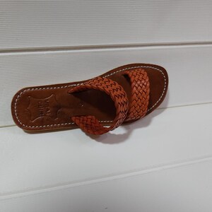 woven leather sandals, moroccan leather sandals, boho sandals women, brown leather sandals, braided leather sandals, artisan flat shoes, moroccan slides, handmade slippers women, summer beach sandals, bohemian leather sandals, real leather sandals, flat moroccan sandals, comfy summer shoes, leather sandals for women, vacation sandals, moroccan fashion shoes, traditional moroccan slippers, stylish flat sandals, rustic leather shoes, braided slide sandals, slip on boho sandals, boho flat leather