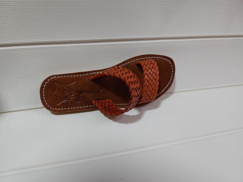 woven leather sandals, moroccan leather sandals, boho sandals women, brown leather sandals, braided leather sandals, artisan flat shoes, moroccan slides, handmade slippers women, summer beach sandals, bohemian leather sandals, real leather sandals, flat moroccan sandals, comfy summer shoes, leather sandals for women, vacation sandals, moroccan fashion shoes, traditional moroccan slippers, stylish flat sandals, rustic leather shoes, braided slide sandals, slip on boho sandals, boho flat leather