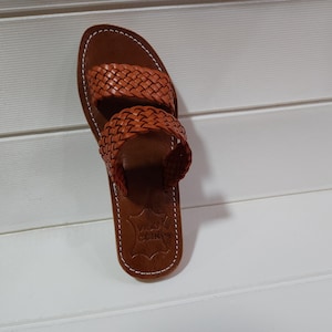 woven leather sandals, moroccan leather sandals, boho sandals women, brown leather sandals, braided leather sandals, artisan flat shoes, moroccan slides, handmade slippers women, summer beach sandals, bohemian leather sandals, real leather sandals, flat moroccan sandals, comfy summer shoes, leather sandals for women, vacation sandals, moroccan fashion shoes, traditional moroccan slippers, stylish flat sandals, rustic leather shoes, braided slide sandals, slip on boho sandals, boho flat leather