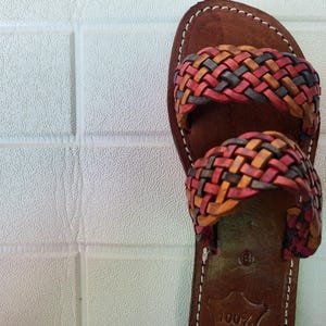 moroccan sandals, handmade sandals, boho sandals women, braided sandals, leather slides women, summer sandals, colorful leather shoes, open toe leather flats, leather shoes for women, slip on summer sandals, beach sandals women, casual leather sandals, flat sandals women, artisan sandals, moroccan shoes, ethnic leather sandals, barefoot sandals, rustic leather shoes, women’s holiday shoes, strappy leather slides, leather footwear, earthy tone sandals, hippie sandals, gypsy sandals