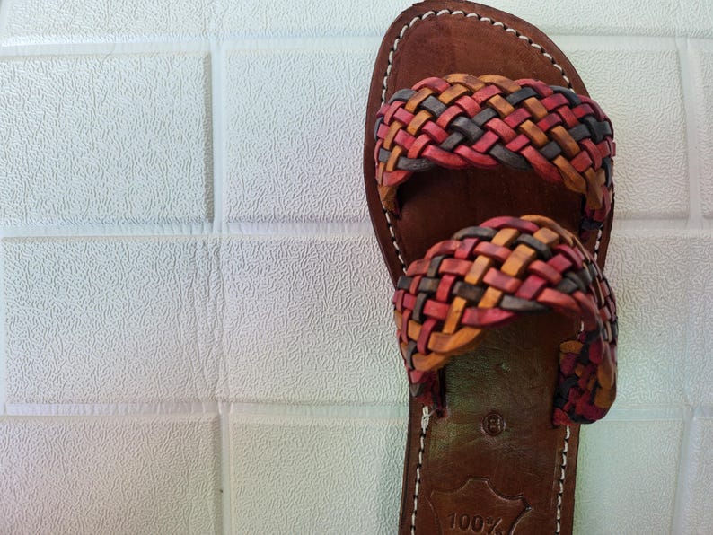 moroccan sandals, handmade sandals, boho sandals women, braided sandals, leather slides women, summer sandals, colorful leather shoes, open toe leather flats, leather shoes for women, slip on summer sandals, beach sandals women, casual leather sandals, flat sandals women, artisan sandals, moroccan shoes, ethnic leather sandals, barefoot sandals, rustic leather shoes, women’s holiday shoes, strappy leather slides, leather footwear, earthy tone sandals, hippie sandals, gypsy sandals