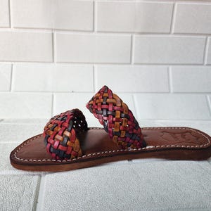 moroccan sandals, handmade sandals, boho sandals women, braided sandals, leather slides women, summer sandals, colorful leather shoes, open toe leather flats, leather shoes for women, slip on summer sandals, beach sandals women, casual leather sandals, flat sandals women, artisan sandals, moroccan shoes, ethnic leather sandals, barefoot sandals, rustic leather shoes, women’s holiday shoes, strappy leather slides, leather footwear, earthy tone sandals, hippie sandals, gypsy sandals