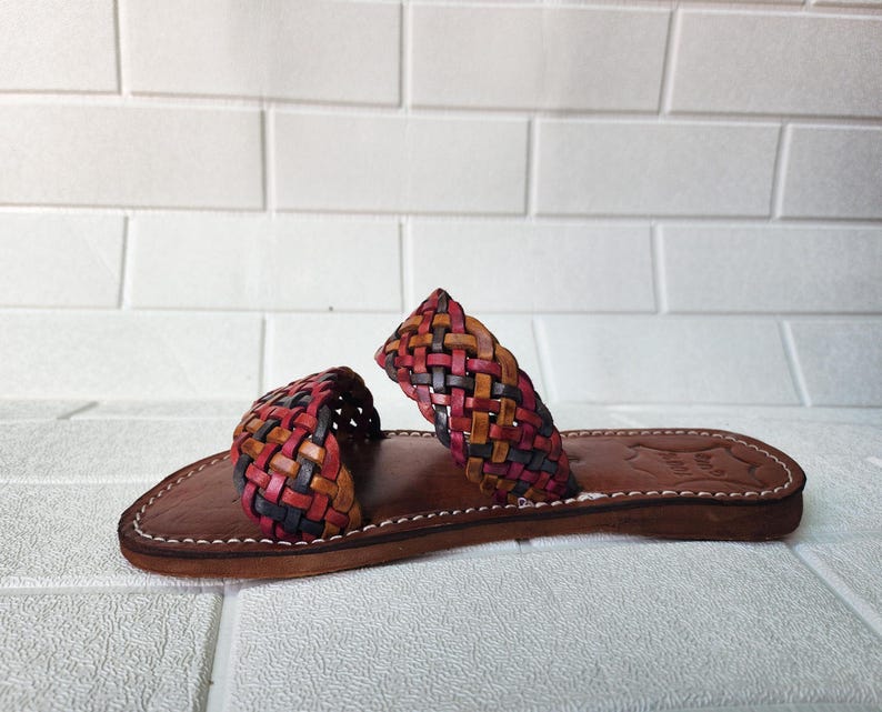 moroccan sandals, handmade sandals, boho sandals women, braided sandals, leather slides women, summer sandals, colorful leather shoes, open toe leather flats, leather shoes for women, slip on summer sandals, beach sandals women, casual leather sandals, flat sandals women, artisan sandals, moroccan shoes, ethnic leather sandals, barefoot sandals, rustic leather shoes, women’s holiday shoes, strappy leather slides, leather footwear, earthy tone sandals, hippie sandals, gypsy sandals