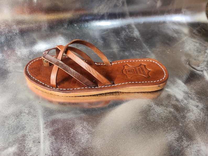 moroccan leather sandals, handmade sandals women, summer sandals, boho chic sandals, open toe sandals, leather flats, slip on shoes, artisanal sandals, moroccan fashion, boho shoes, minimalist sandals, summer shoes women, comfy leather sandals, gift for her, brown sandals women, moroccan handmade, leather strappy sandals, natural leather slides, eco sandals, moroccan gift idea, handmade morocco, rustic sandals, summer fashion women, brown boho shoes, moroccan artisan, tan leather sandals