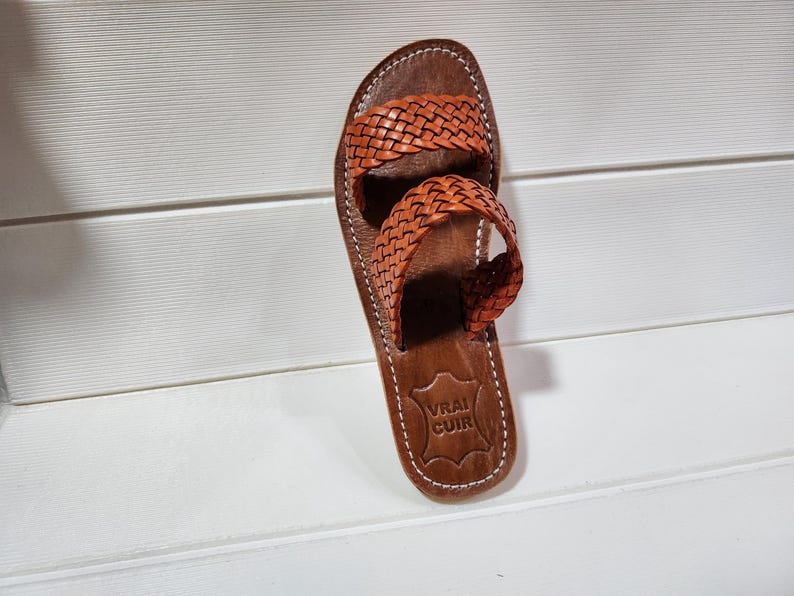 woven leather sandals, moroccan leather sandals, boho sandals women, brown leather sandals, braided leather sandals, artisan flat shoes, moroccan slides, handmade slippers women, summer beach sandals, bohemian leather sandals, real leather sandals, flat moroccan sandals, comfy summer shoes, leather sandals for women, vacation sandals, moroccan fashion shoes, traditional moroccan slippers, stylish flat sandals, rustic leather shoes, braided slide sandals, slip on boho sandals, boho flat leather