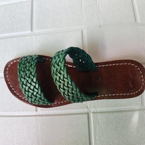 moroccan sandals, handmade sandals, boho sandals women, braided sandals, leather slides women, green summer shoes, green leather sandals, open toe sandals, casual leather slides, artisan sandals, flat sandals women, leather footwear, ethnic leather sandals, barefoot sandals, hippie shoes women, vacation sandals, moroccan shoes, resort sandals women, leather slippers, rustic sandals, green boho sandals, earthy tone sandals, gypsy sandals, slip on leather flats, summer shoes women, handmade sandal