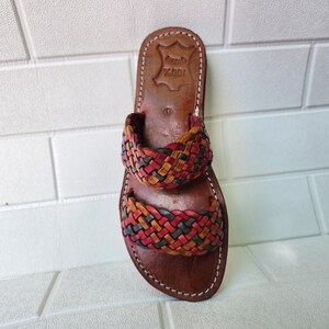 moroccan sandals, handmade sandals, boho sandals women, braided sandals, leather slides women, summer sandals, colorful leather shoes, open toe leather flats, leather shoes for women, slip on summer sandals, beach sandals women, casual leather sandals, flat sandals women, artisan sandals, moroccan shoes, ethnic leather sandals, barefoot sandals, rustic leather shoes, women’s holiday shoes, strappy leather slides, leather footwear, earthy tone sandals, hippie sandals, gypsy sandals
