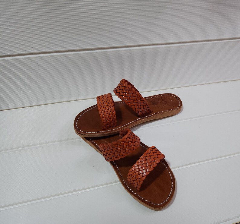 woven leather sandals, moroccan leather sandals, boho sandals women, brown leather sandals, braided leather sandals, artisan flat shoes, moroccan slides, handmade slippers women, summer beach sandals, bohemian leather sandals, real leather sandals, flat moroccan sandals, comfy summer shoes, leather sandals for women, vacation sandals, moroccan fashion shoes, traditional moroccan slippers, stylish flat sandals, rustic leather shoes, braided slide sandals, slip on boho sandals, boho flat leather