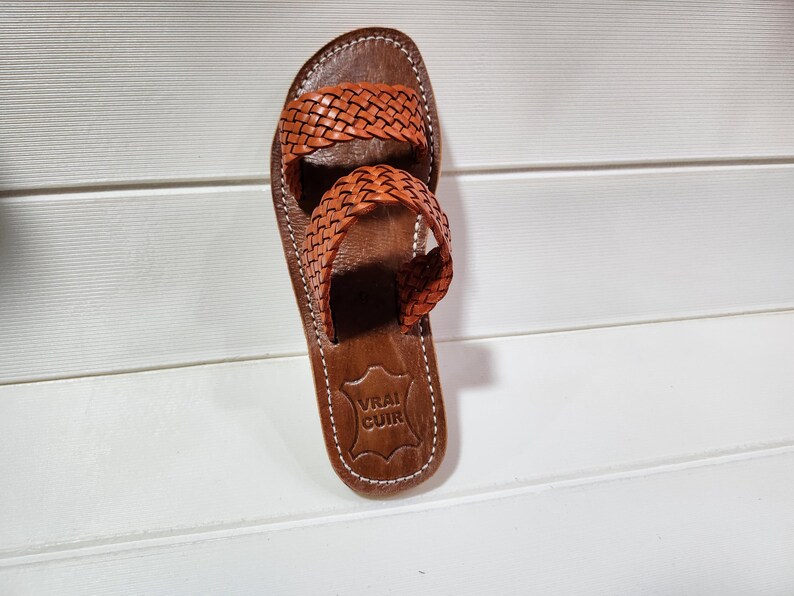 woven leather sandals, moroccan leather sandals, boho sandals women, brown leather sandals, braided leather sandals, artisan flat shoes, moroccan slides, handmade slippers women, summer beach sandals, bohemian leather sandals, real leather sandals, flat moroccan sandals, comfy summer shoes, leather sandals for women, vacation sandals, moroccan fashion shoes, traditional moroccan slippers, stylish flat sandals, rustic leather shoes, braided slide sandals, slip on boho sandals, boho flat leather