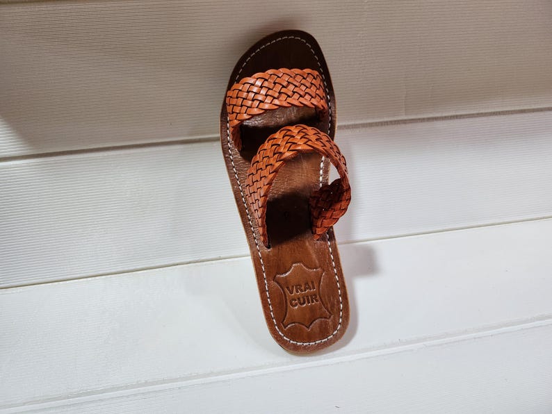 woven leather sandals, moroccan leather sandals, boho sandals women, brown leather sandals, braided leather sandals, artisan flat shoes, moroccan slides, handmade slippers women, summer beach sandals, bohemian leather sandals, real leather sandals, flat moroccan sandals, comfy summer shoes, leather sandals for women, vacation sandals, moroccan fashion shoes, traditional moroccan slippers, stylish flat sandals, rustic leather shoes, braided slide sandals, slip on boho sandals, boho flat leather