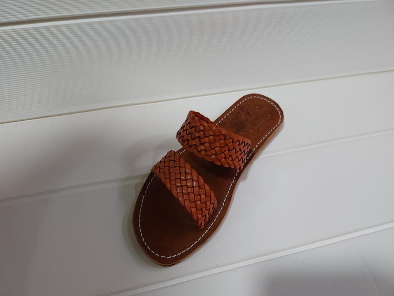 woven leather sandals, moroccan leather sandals, boho sandals women, brown leather sandals, braided leather sandals, artisan flat shoes, moroccan slides, handmade slippers women, summer beach sandals, bohemian leather sandals, real leather sandals, flat moroccan sandals, comfy summer shoes, leather sandals for women, vacation sandals, moroccan fashion shoes, traditional moroccan slippers, stylish flat sandals, rustic leather shoes, braided slide sandals, slip on boho sandals, boho flat leather