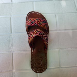 moroccan sandals, handmade sandals, boho sandals women, braided sandals, leather slides women, summer sandals, colorful leather shoes, open toe leather flats, leather shoes for women, slip on summer sandals, beach sandals women, casual leather sandals, flat sandals women, artisan sandals, moroccan shoes, ethnic leather sandals, barefoot sandals, rustic leather shoes, women’s holiday shoes, strappy leather slides, leather footwear, earthy tone sandals, hippie sandals, gypsy sandals