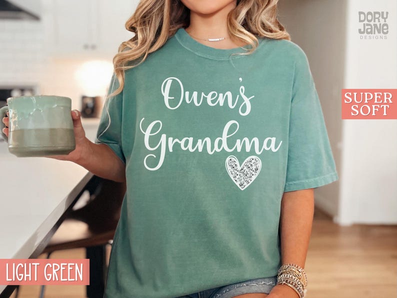 May include: Light green t-shirt with the text "Owen's Grandma" and a sparkly heart.