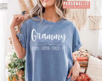 May include: A blue t-shirt with the word "Grammy" and a heart design above the names "Oliver, Griffin, Gracie, Lily" in white text.