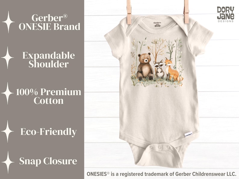 May include: A beige Gerber Onesie&reg; bodysuit with a woodland animal print featuring a bear, raccoon, and fox. The text "Dory Jane Designs" is printed on the right side of the image. The Onesie&reg; has an expandable shoulder and snap closure.