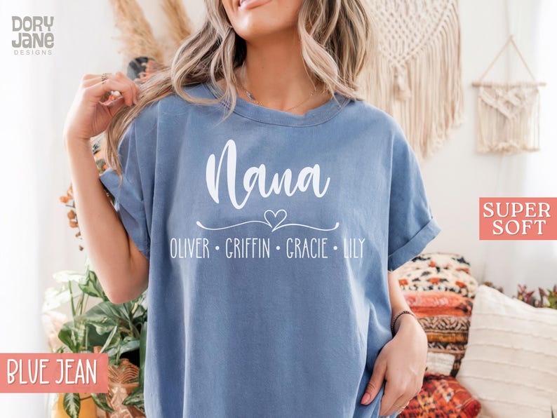 May include: A blue jean t-shirt with the word "Nana" and a heart design. Below the word "Nana" are the names "Oliver, Griffin, Gracie, Lily". The t-shirt is labeled "Super Soft".